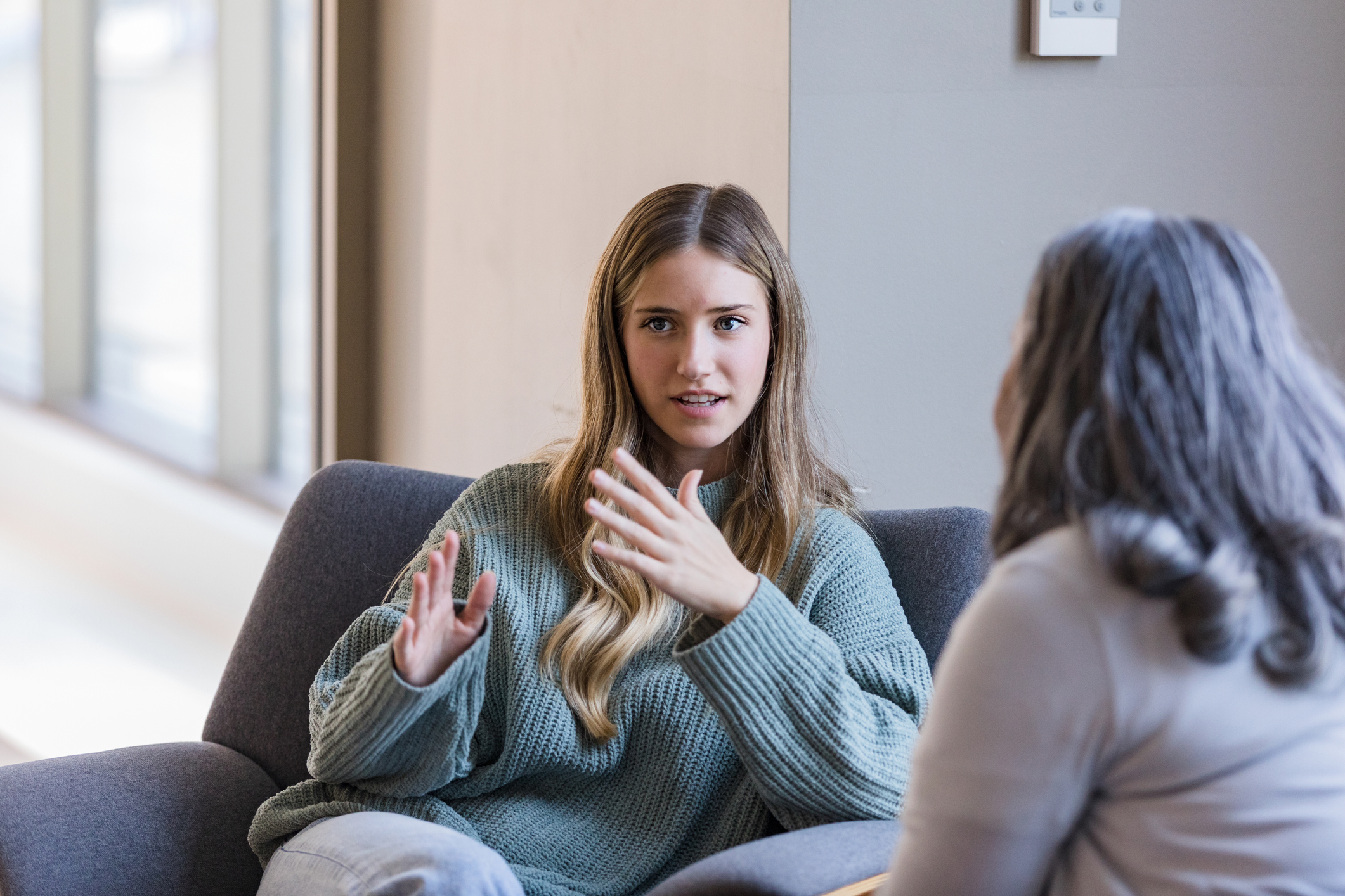 Young university student talks with counsellor