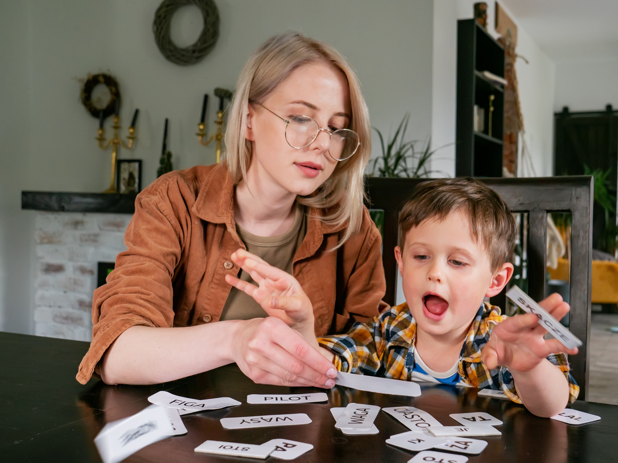 Mother and daughter playing with toy blocks